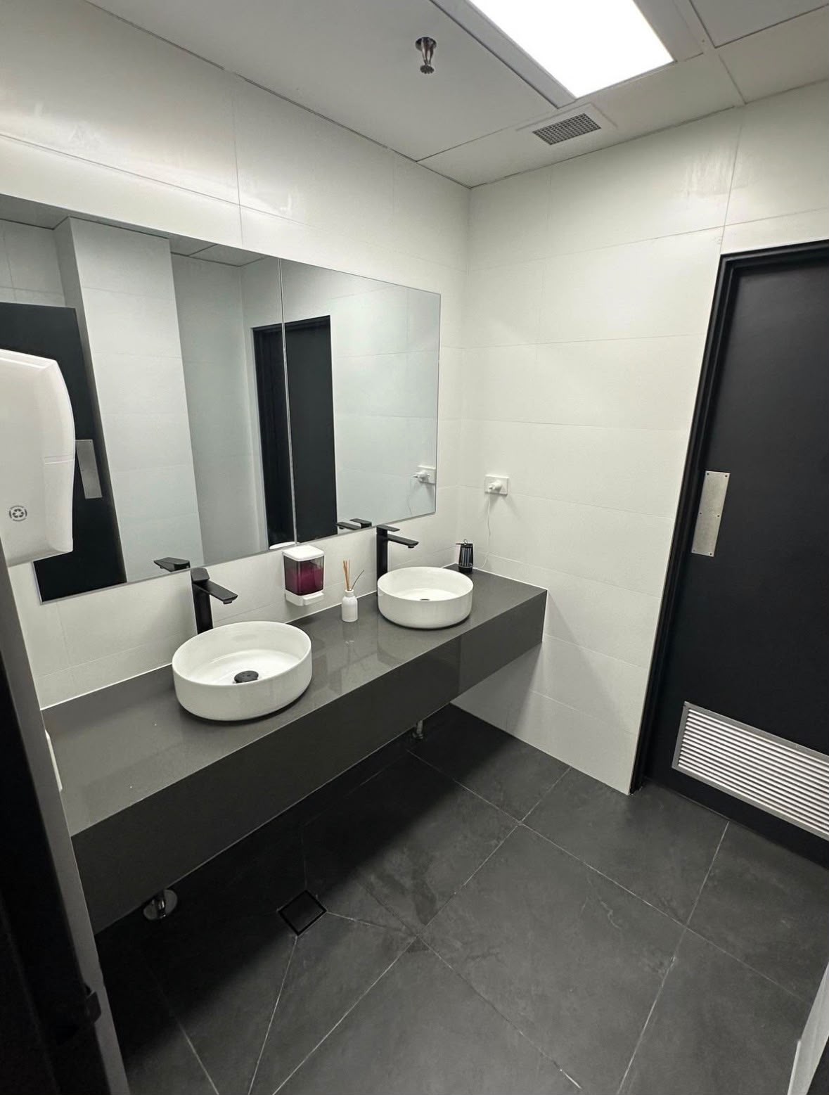 The same commercial washroom after a Capital Cleaning Company clean, spotless